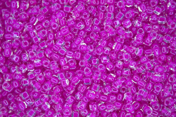 10g MIYUKI 10/0 Triangle Japanese Seed Beads 2.5mm 1110 Color Lined Fuchsia