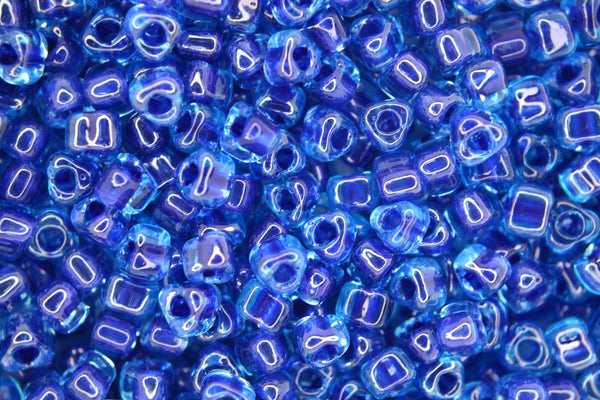 10g MIYUKI 5/0 Triangle Japanese Seed Beads 5mm 1828 Color Lined Light Dark Blue