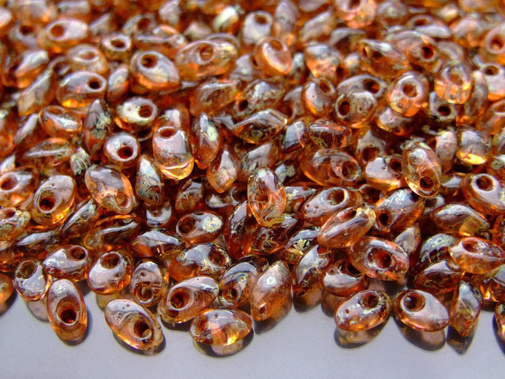 10g MIYUKI Long Magatama Japanese Beads 4x7mm Picasso Transparent Light Smoky Topaz Beadacious