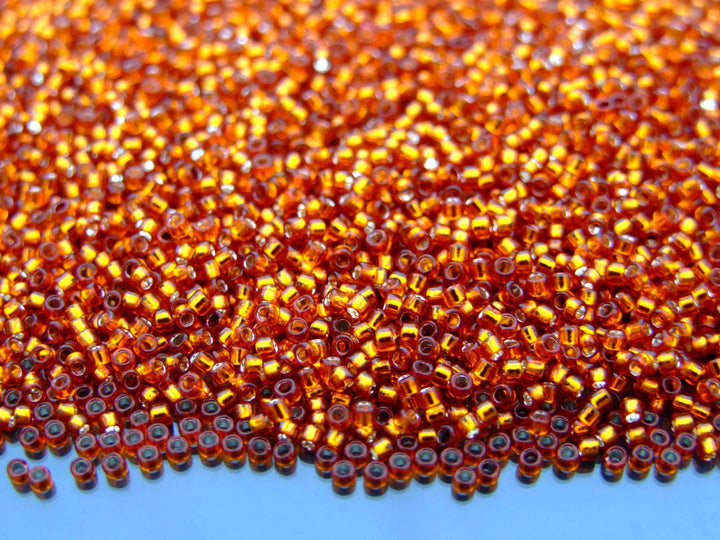 10g TOHO 15/0 Round Japanese Seed Beads 1.5mm 2208 Silver Lined Burnt Orange Beadacious