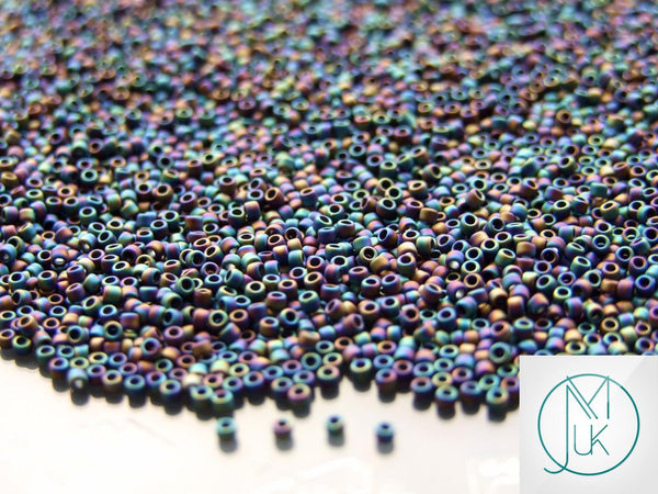 10g TOHO 15/0 Round Japanese Seed Beads 1.5mm 86F Opaque Frosted Rainbow Iris Beadacious