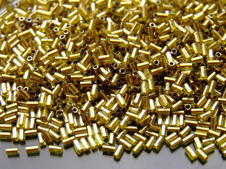 10g TOHO 3mm Bugle Japanese Seed Beads 991 Gold Lined Peridot Beadacious