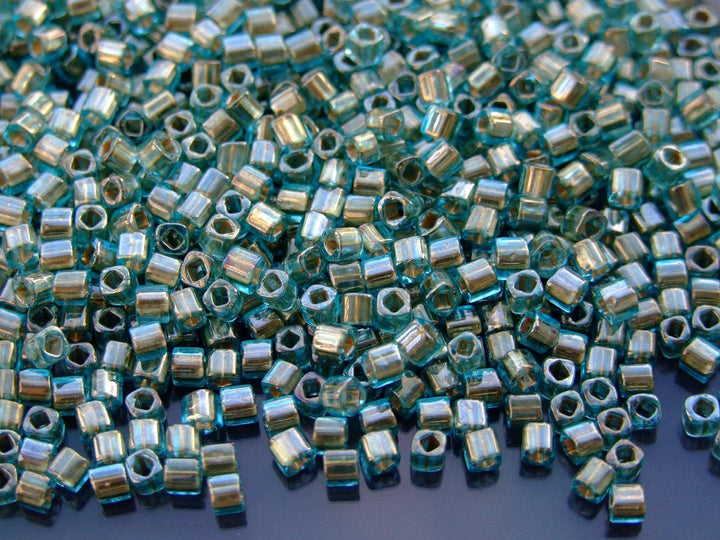 10g TOHO 3mm Cube Japanese Seed Beads 990 Gold Lined Aquamarine Beadacious