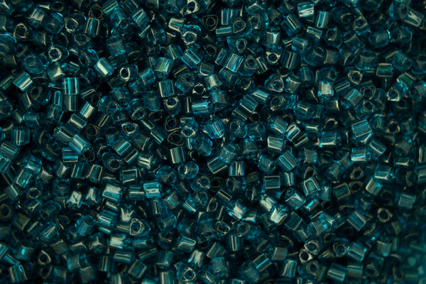 10g TOHO 11/0 Triangle Japanese Seed Beads 2mm 7BD Transparent Capri Blue