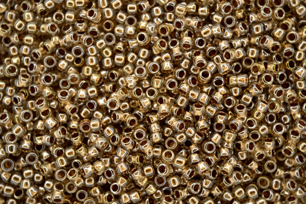 10g TOHO 11/0 Takumi japanische Rocailles 2mm 989 Golden Lined Crystal