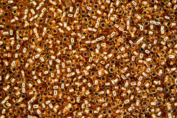 10g TOHO 11/0 Round Japanese Seed Beads 2mm 744 Copper Lined Light Topaz