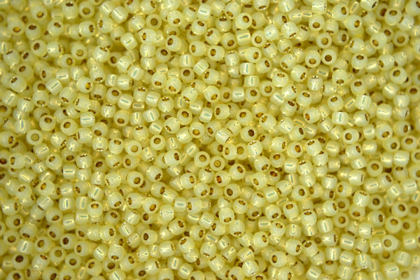 10g TOHO 11/0 Round Japanese Seed Beads 2mm PF2109 PermaFinish Silver Lined Milky Jonquil